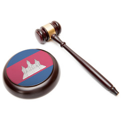 Judge gavel and soundboard with national flag on it - Cambodia