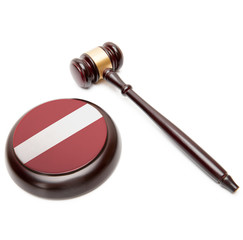 Judge gavel and soundboard with national flag on it - Latvia