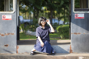 Girl wearing glasses smiling.