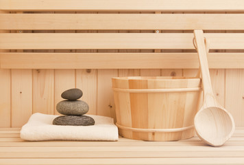 Fototapeta na wymiar sauna and spa accessories with zen stones