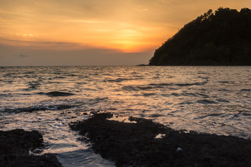 Seascape view with sunset background.