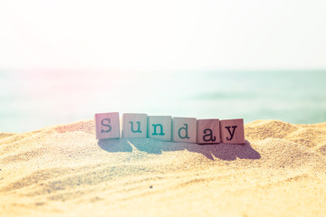 Sunday word on sea beach in retro style