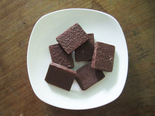 chocolate coated wafer on white dish