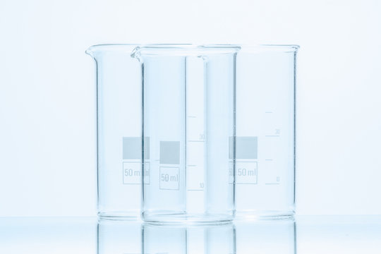 Set of three empty temperature resistant cylindrical beakers for