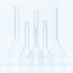 Set of six empty flat-bottomed flasks of different capacity for