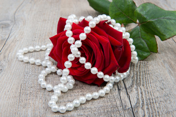 a rose and a pearls necklace for Valentine's Day