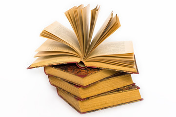 Four old antique books.