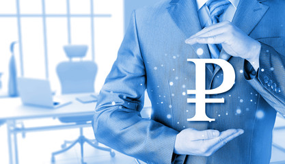 businessman protecting ruble  symbol