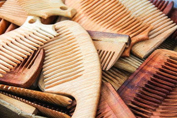 Lots of hand made wooden comb closeup