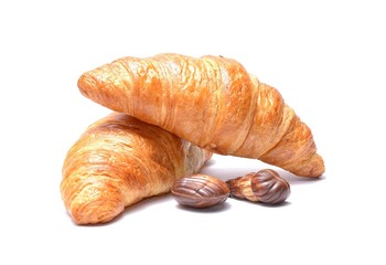 Chocolate croissant and candies isolated on white background