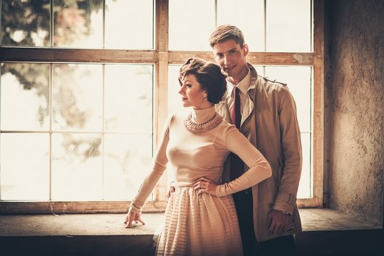 Beautiful Vintage Style Couple Standing Near Window