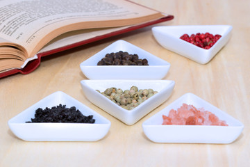 Variety of peppercorns and salt