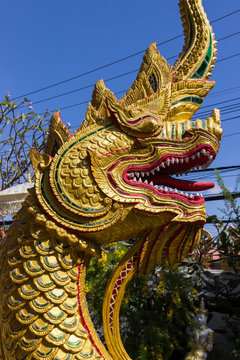 golden naga snake statue