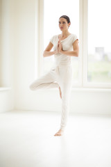 Woman Doing Yoga In Room