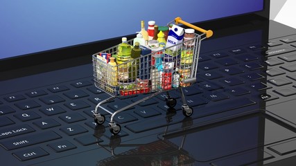 Full with products supermarket shopping cart on keyboard © viperagp