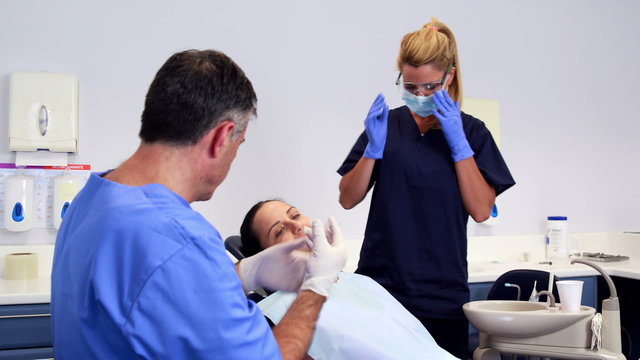 Dentist about to giving patient an injection