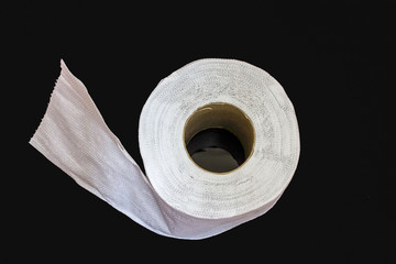 toilet paper isolated on black