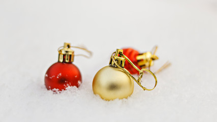 New year decoration balls on white snow