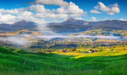 Colorful summer morning in the Carpathian mountain village