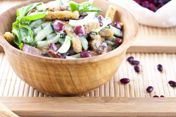 salad with beans, bacon, cucumber and croutons