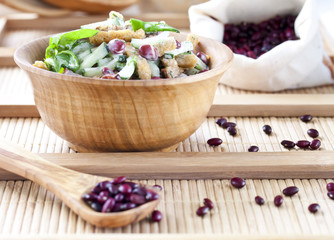 salad with beans, bacon, cucumber and croutons