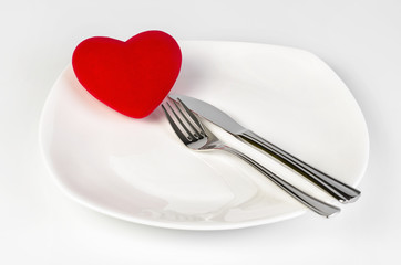 Red Heart shape on a white plate with clipping path