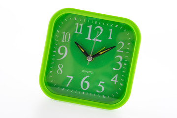 Green clock isolated on white background