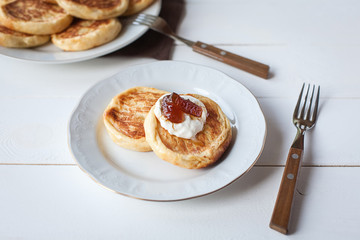breakfast with cheese pancakes, coffee and jam