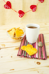 Pastry Cookies in the Shape of Hearts with Cup of Tea