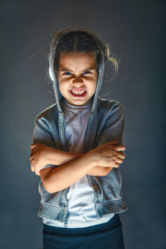 scary girl child on Halloween face terrifies image of evil and t