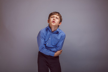 teenager boy abdominal pain on gray  background