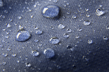 Blue waterproof membrane textile background with drops - obrazy, fototapety, plakaty