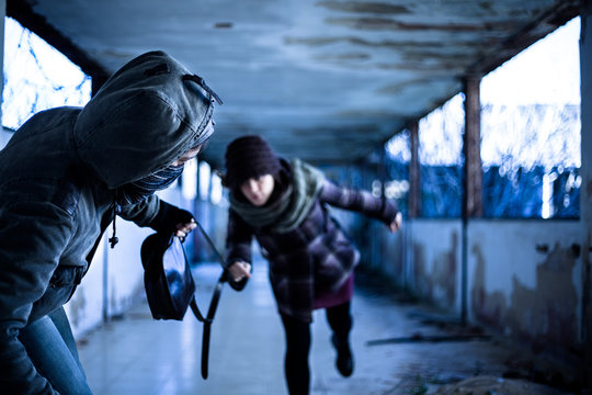 Snatcher Stealing a Bag from a Woman