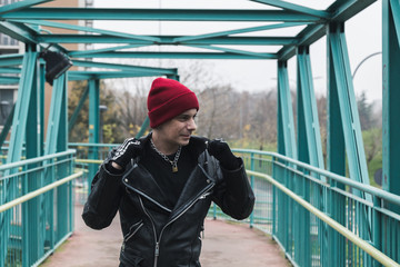 Punk guy posing in the city streets