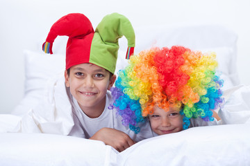 Happy kids with clown hat and hair