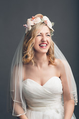 Charming vivacious young bride laughing