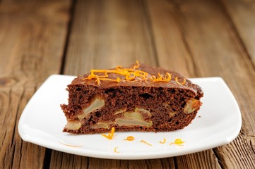 Chocolate apple cake with orange peels