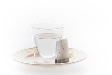 Glass of hot water with a tea bag