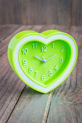 Clock on wood background