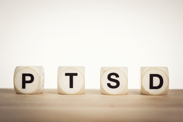 PTSD spelled out with toy dice