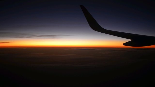 plane wing window sky sunset