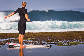 man doing exercises at the beach
