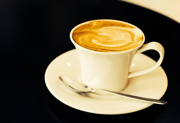 Latte coffee cup on table