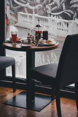 Breakfast with tea, coffee, sandwiches and cheesecakes in a cafe