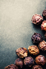 Black Peppercorns closeup. Black pepper on dark background with