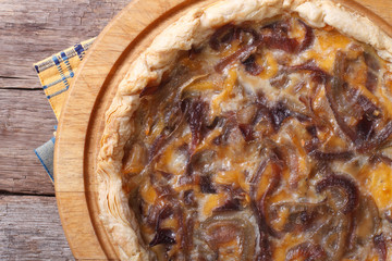 hot onion tart with cheese and cream closeup. Horizontal