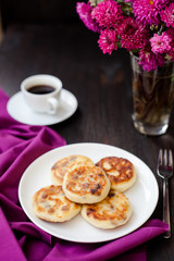 Delicious homemade cheese pancakes with black coffee