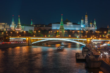 Naklejka na ściany i meble Evening in Moscow. Night view of the Kremlin and bridge