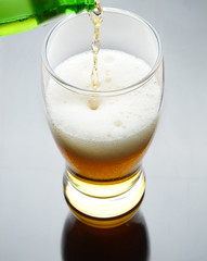 Pouring beer into glass