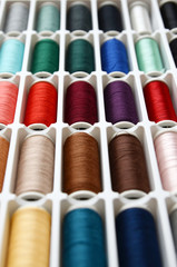 Fototapeta na wymiar Multicolored sewing threads background